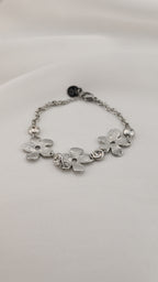 Bracciale con fiori metallici e pietre trasparenti
