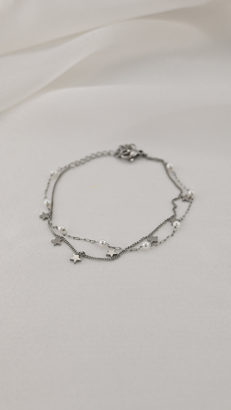 Bracciale doppia catena con simboli e perle