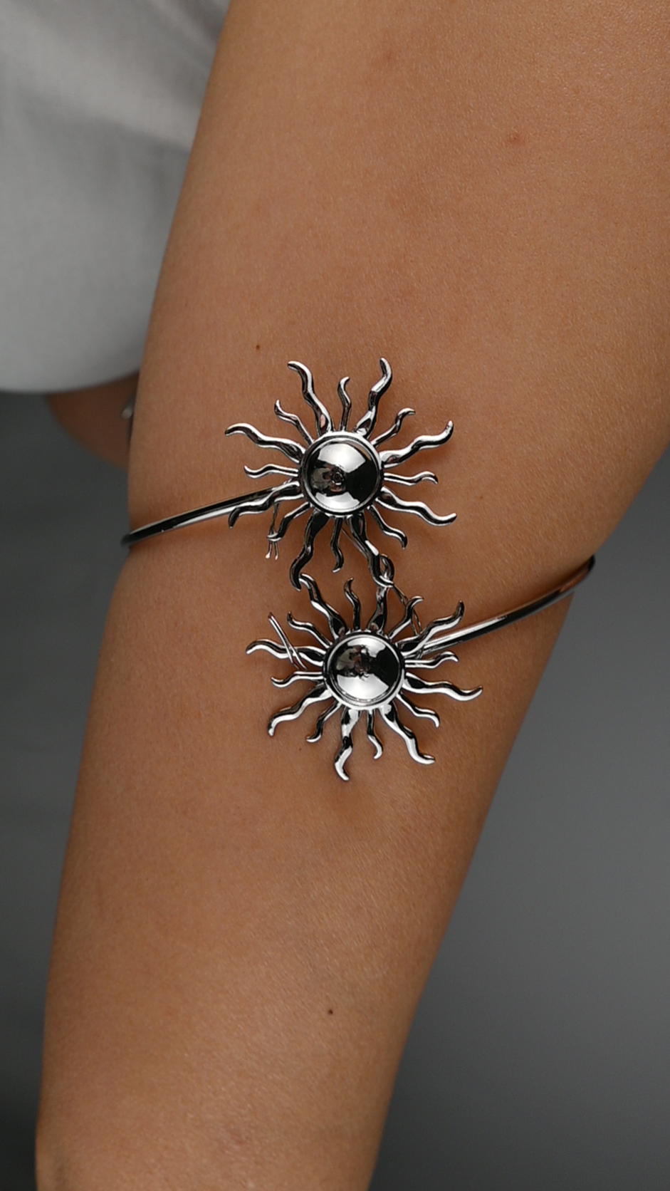 Bicep cuff with two suns