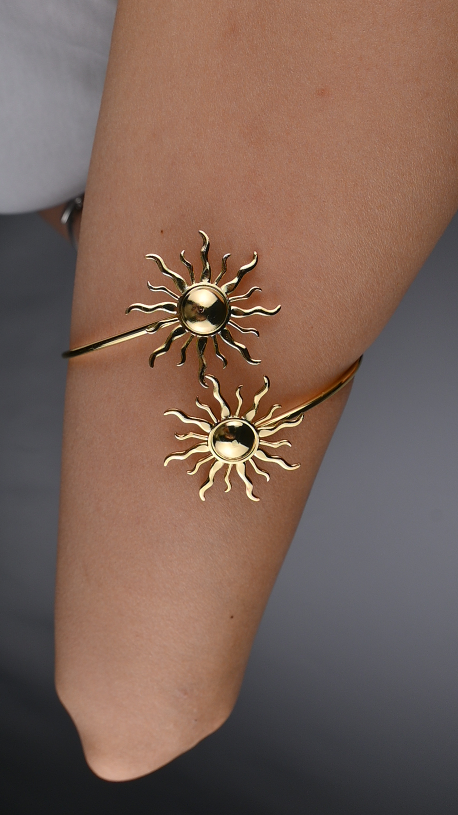 Bicep cuff with two suns