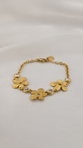 Bracciale con fiori metallici e pietre trasparenti