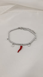 Bracciale con corno rosso e cristalli
