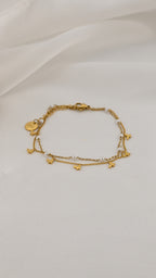 Bracciale doppia catena con simboli e perle