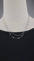 Collana doppia catena con simboli e perle
