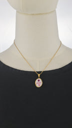 Collana dorata con ciondolo tondo