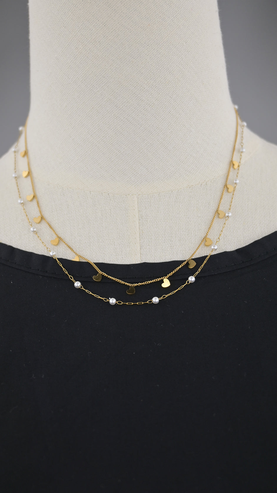 Collana doppia catena con simboli e perle