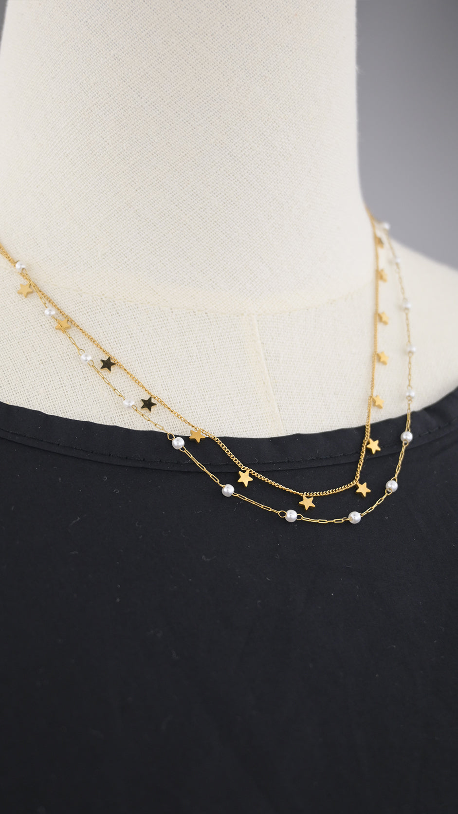 Collana doppia catena con simboli e perle