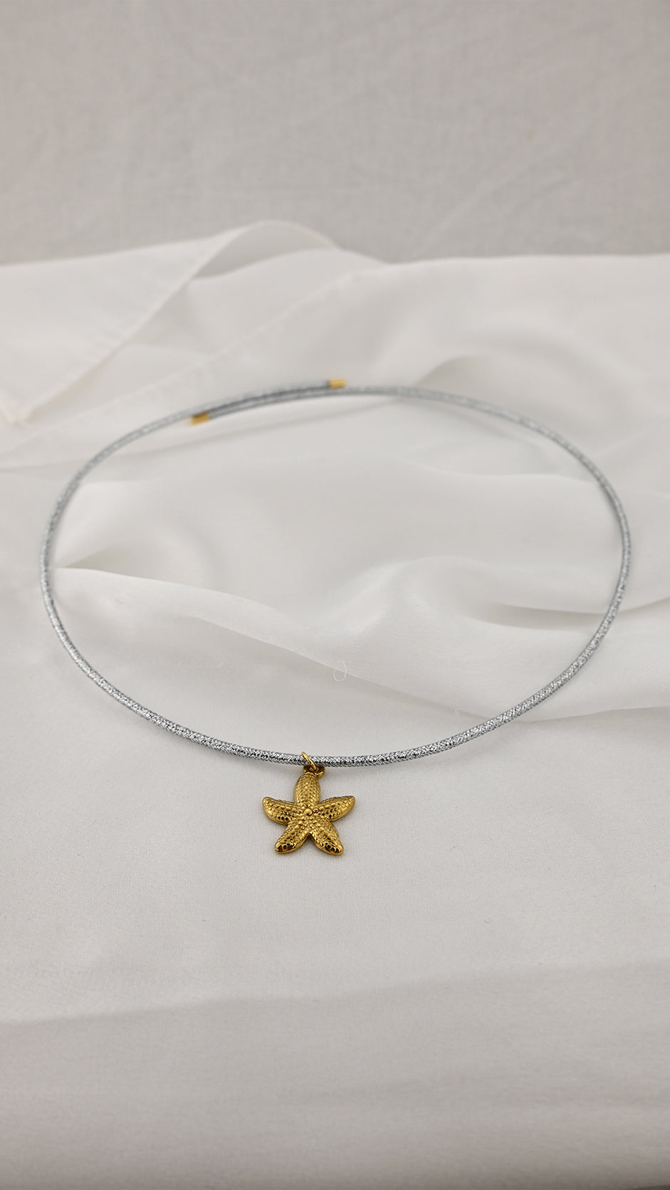 Bracciale/ Girocollo regolabile con pendente a stella marina