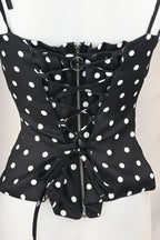 Top a pois con fiore e retro corsetto